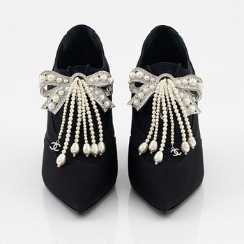 Chanel, a pair of pearl and strass bow pumps, size 37.