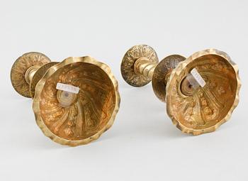 A pair of brass candlesticks, 18th century.