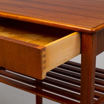 a pair of mahogany bedside tables.