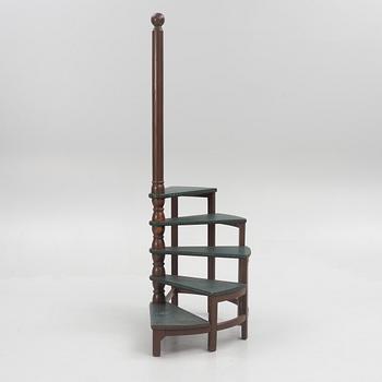 Amid 20th century library ladder.