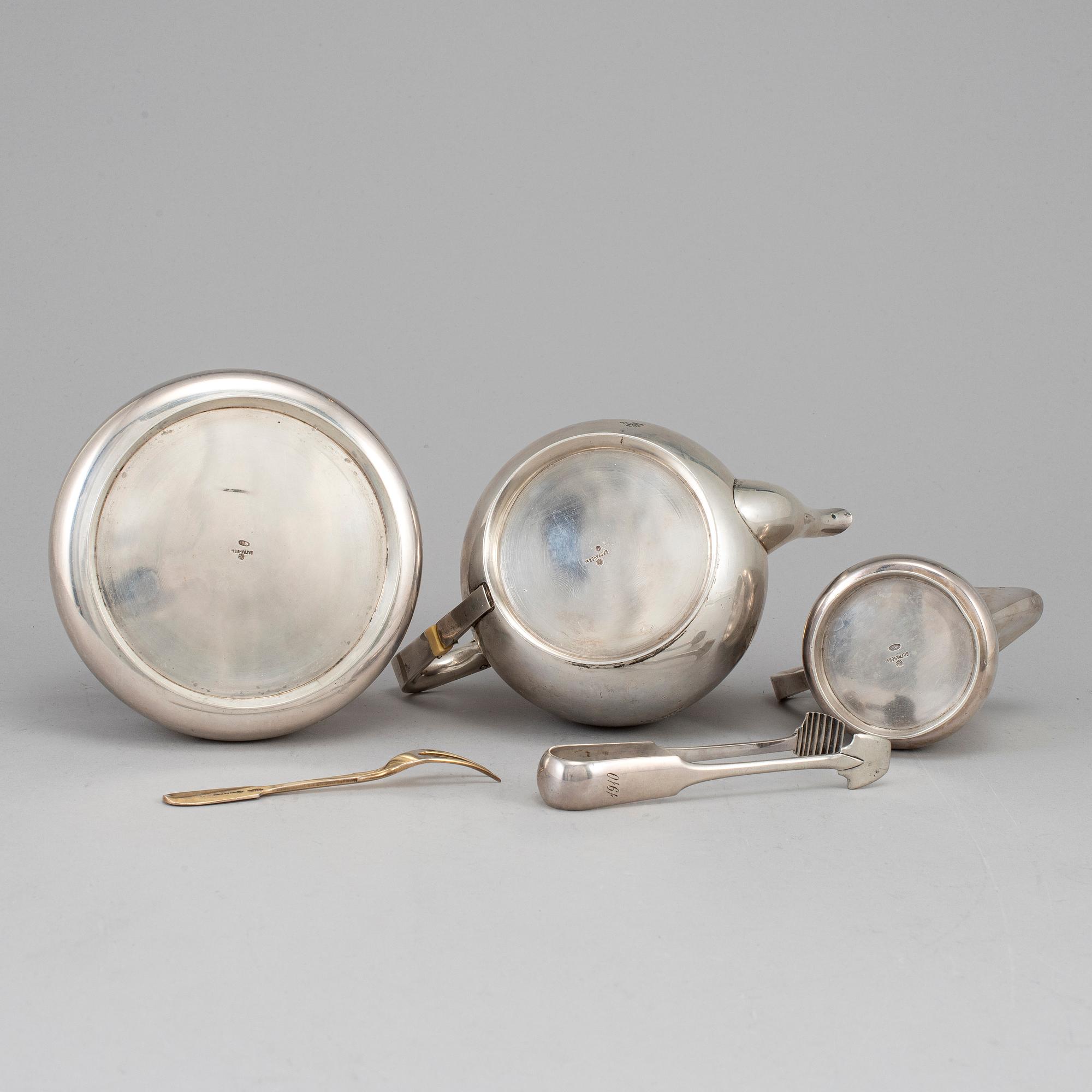 A Russian early 20th century parcel-gilt silver 5 piece tea-set, mark of Grachev, St. Petersburg 1908-1917.