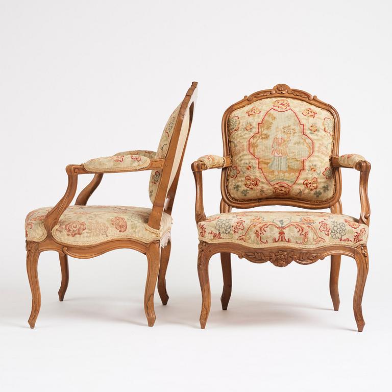 A matched pair of French Louis XV armchairs, mid 18th century.