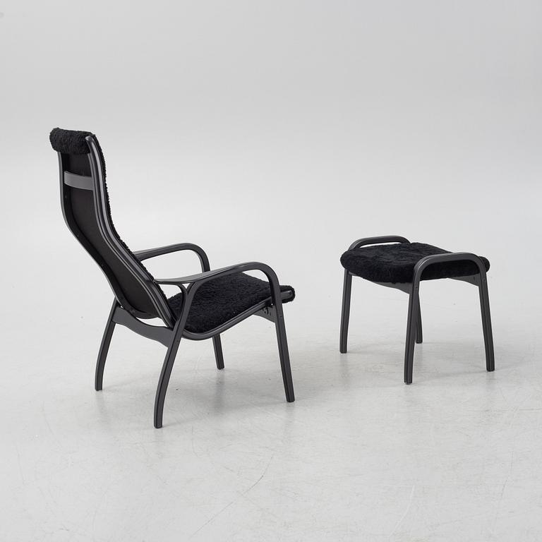 Yngve Ekström, a 'Lamino' armchair with stool, Swedese, Sweden, 2019.