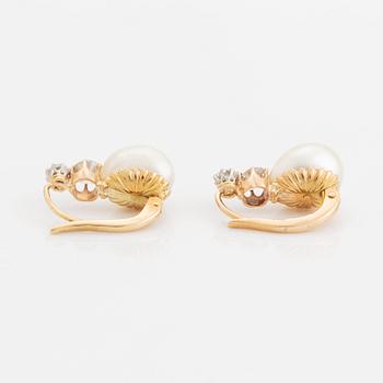 A pair of 18K gold and pearl earrings set with old-cut diamonds.