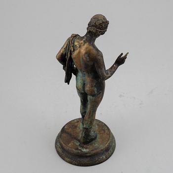 A 20th century bronze sculpture of Narcissus.