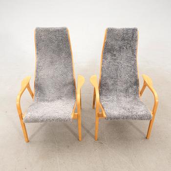 Yngve Ekström, a pair of "Lamino" armchairs for Swedese, late 20th century.