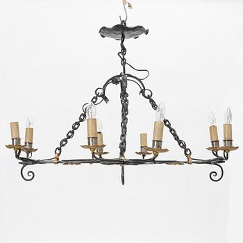 A chalet style wrought iron mid 20th C chandelier.