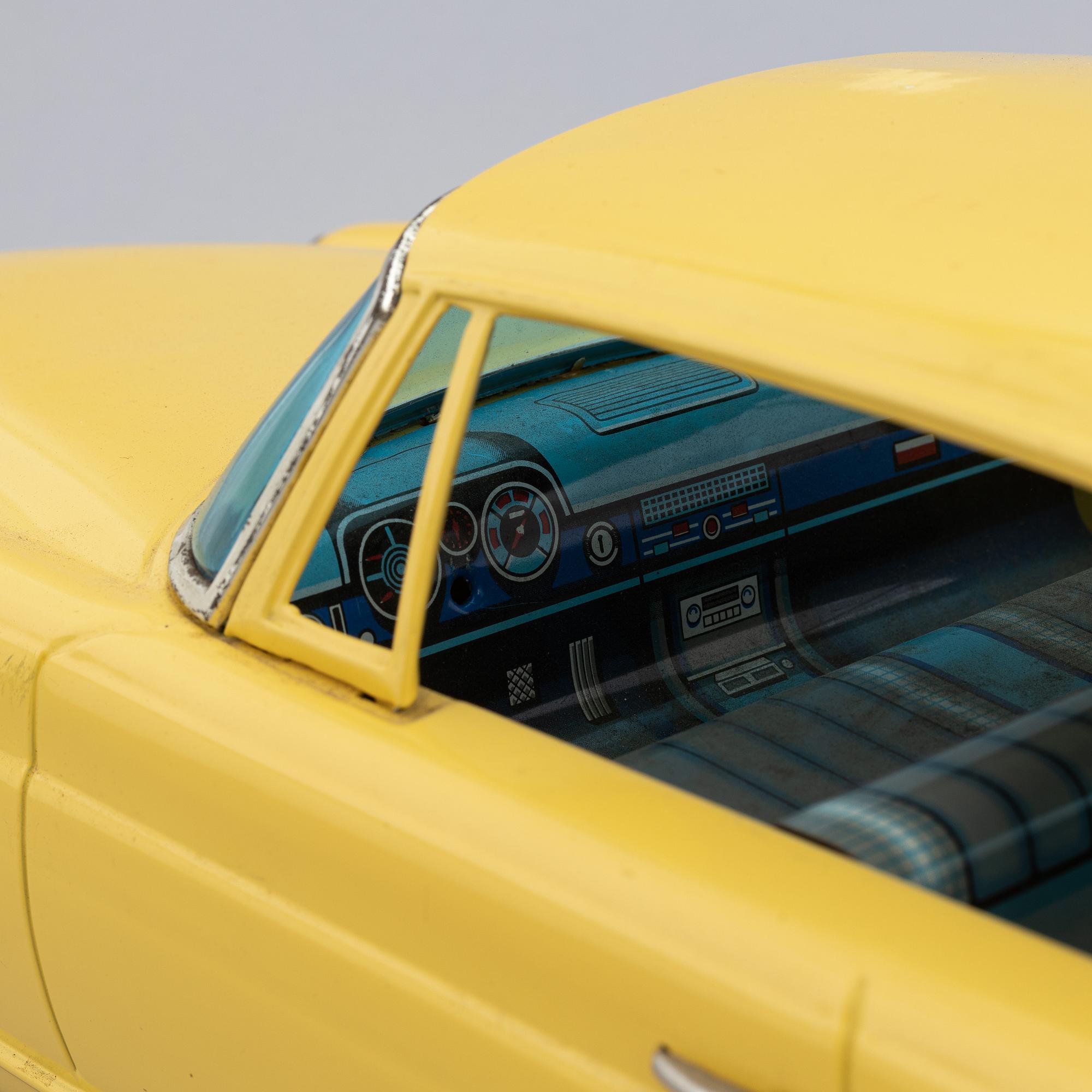 A scale tin model of a Mercedes-Benz 300 SE by Ichiko, in a box.
