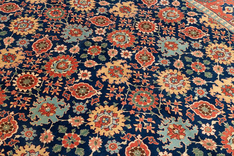 A Tabriz carpet of Harshang design, c. 353 x 250 cm.