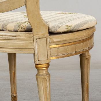 A set of four Louis XVI-style chairs from the early 20th century.