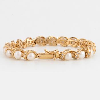 ARMBAND 14K guld, diamanter och pärlor.