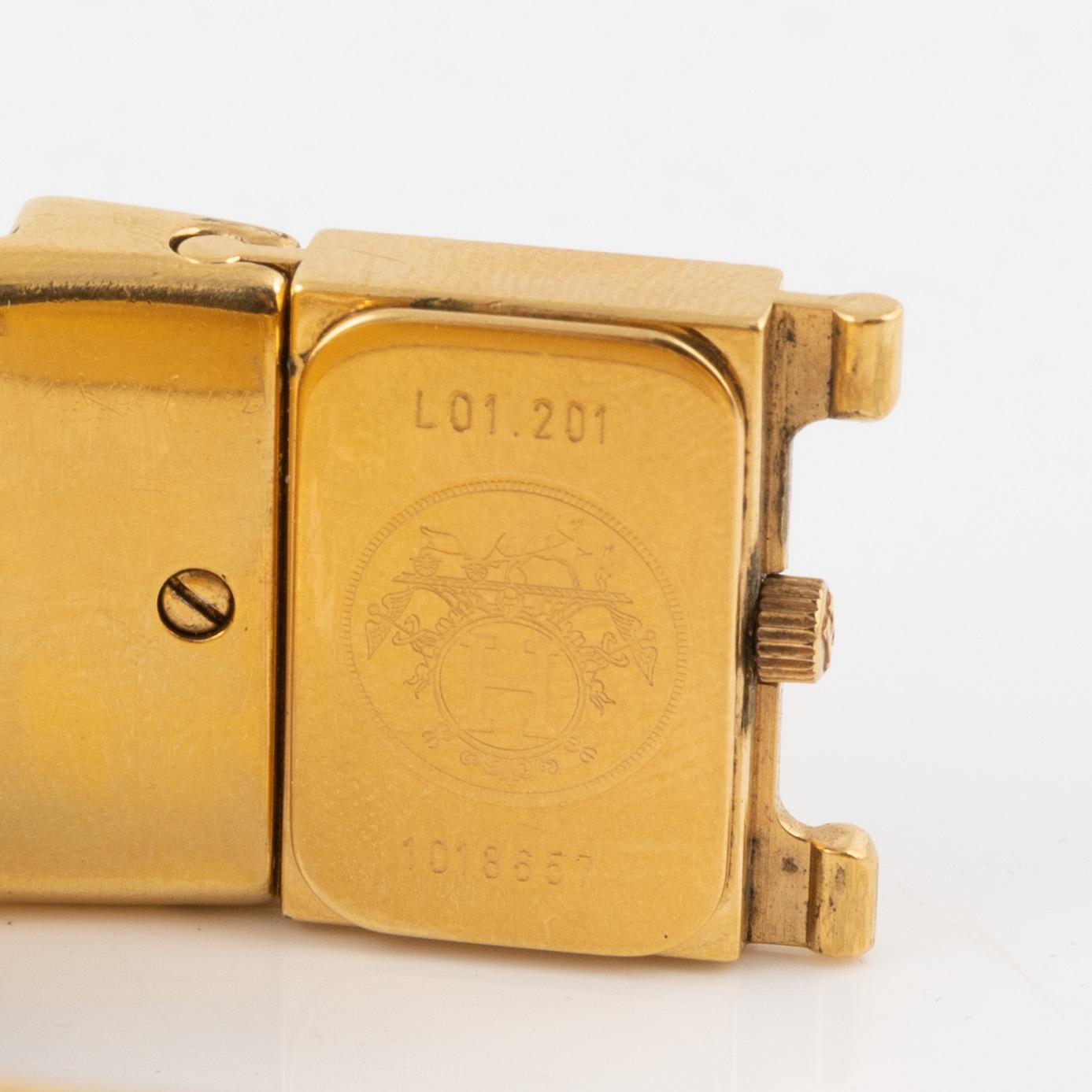 Hermès, A enamel and gold hardware 'Loquet watch'.