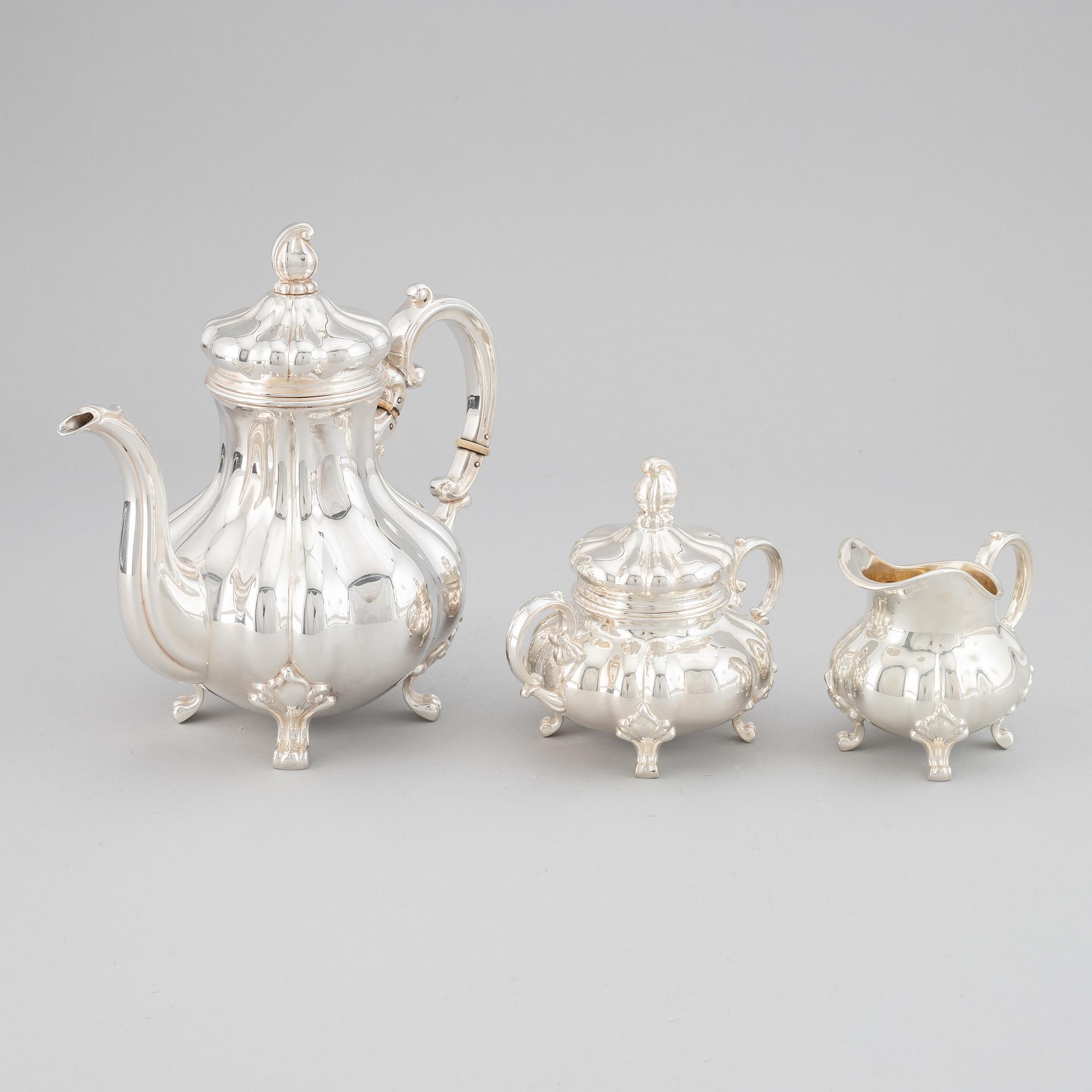 A 20th century silver coffee pot, creamer and sugar bowl. Swedish import mark.