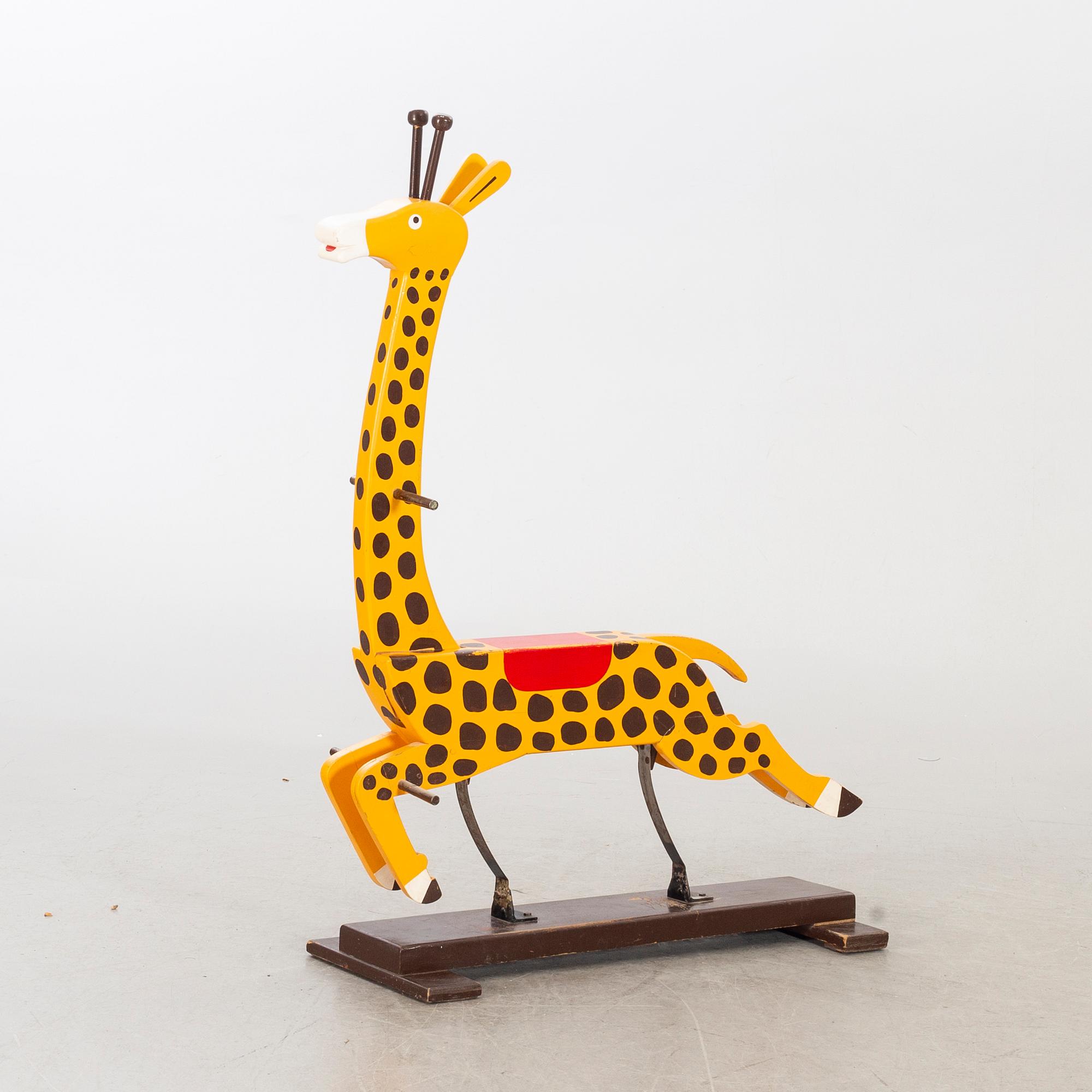 A second half of the 20th century rocking giraffe.