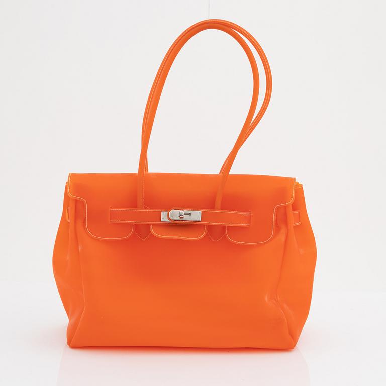 I santi an orange rubber bag.