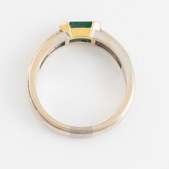 An 18K gold ring with an emerald and diamonds ca. 0.80 ct in total. Import marked A Tillander, Helsinki 1962.