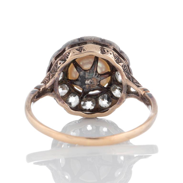 A pearl ring set with old-cut diamonds.