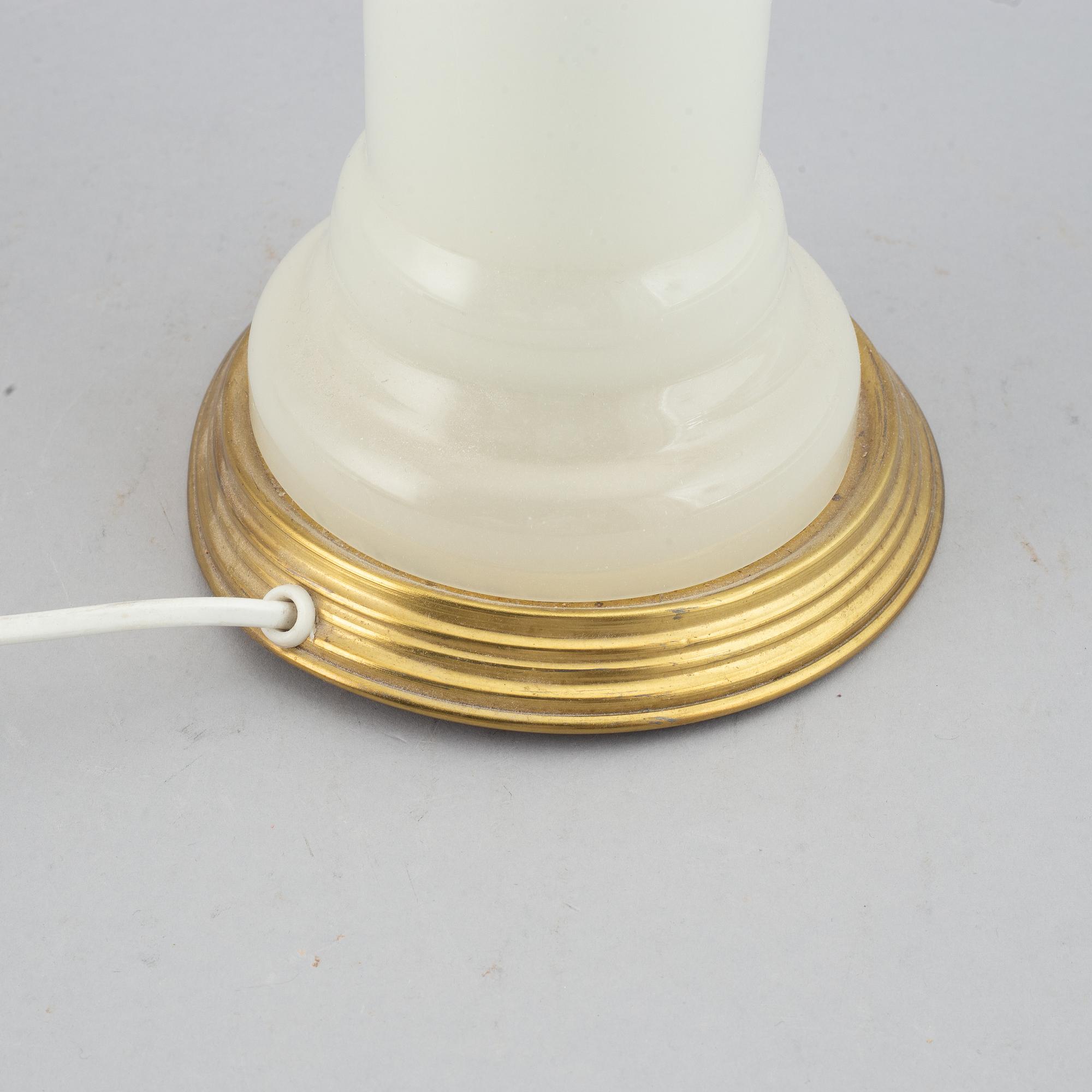 A brass and glass table lamp with lamp-shade. Svenskt Tenn, model no. 2583.