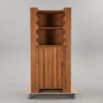 A corner cabinet by Axel Einar Hjorth.