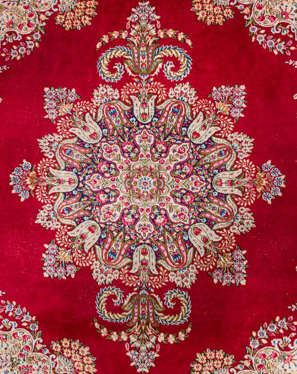 A carpet, Kirman, ca. 333 x 244 cm.