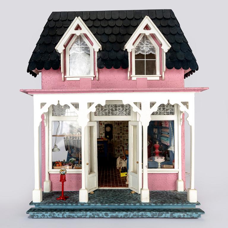 A handmade dolls house later part of the 20th century.