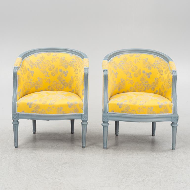 A painted sofa, table, a pair of chairs, a pair of armchairs, a pair of stools, Gustavian style, 20th Century.