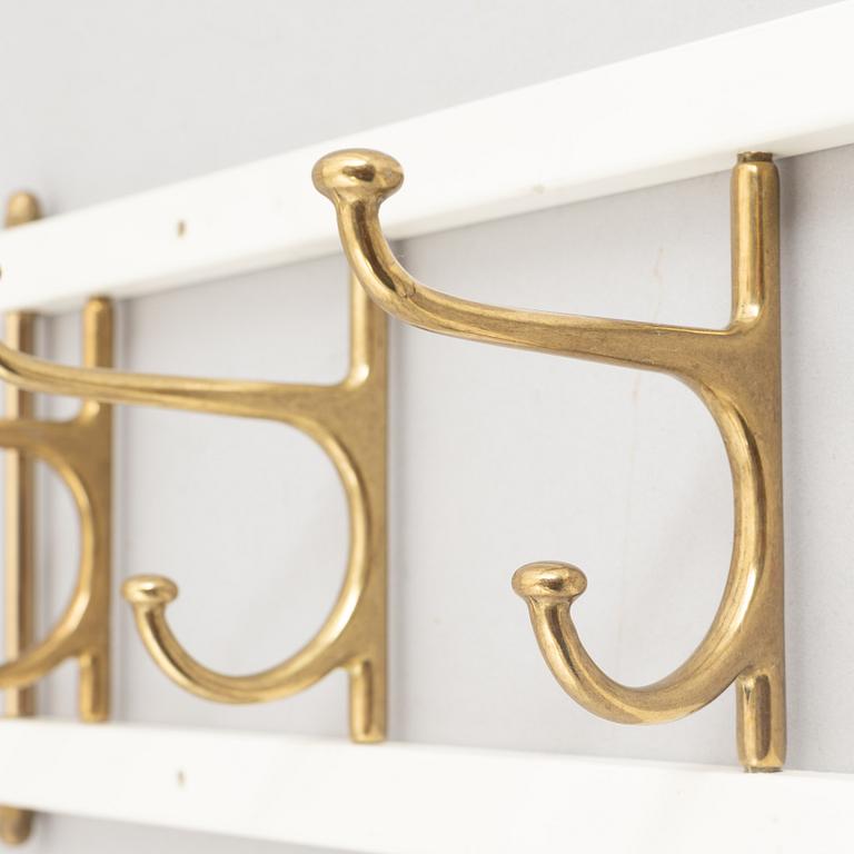 Klädhängare, "Dekorativ", Skoglunds metallgjuteri, Anderstorp, 1900-talets mitt.