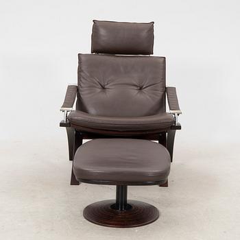 Åke Fribyter, an armchair and fotstool by Nelo, Knislinge, second half of the 20th Century.