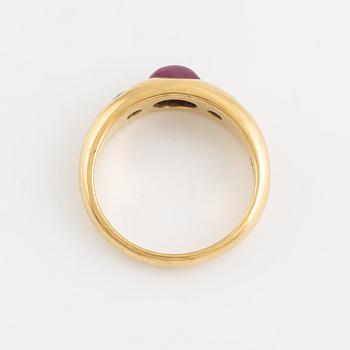 Cabochon cut ruby and brilliant cut diamond ring.