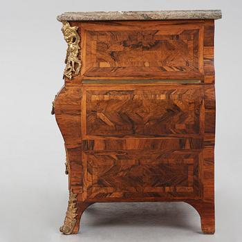 A Swedish early rococo parquetry, ormolu-mounted and marble commode, presumably by S. Pasch or J. Wulf , ca. 1740.