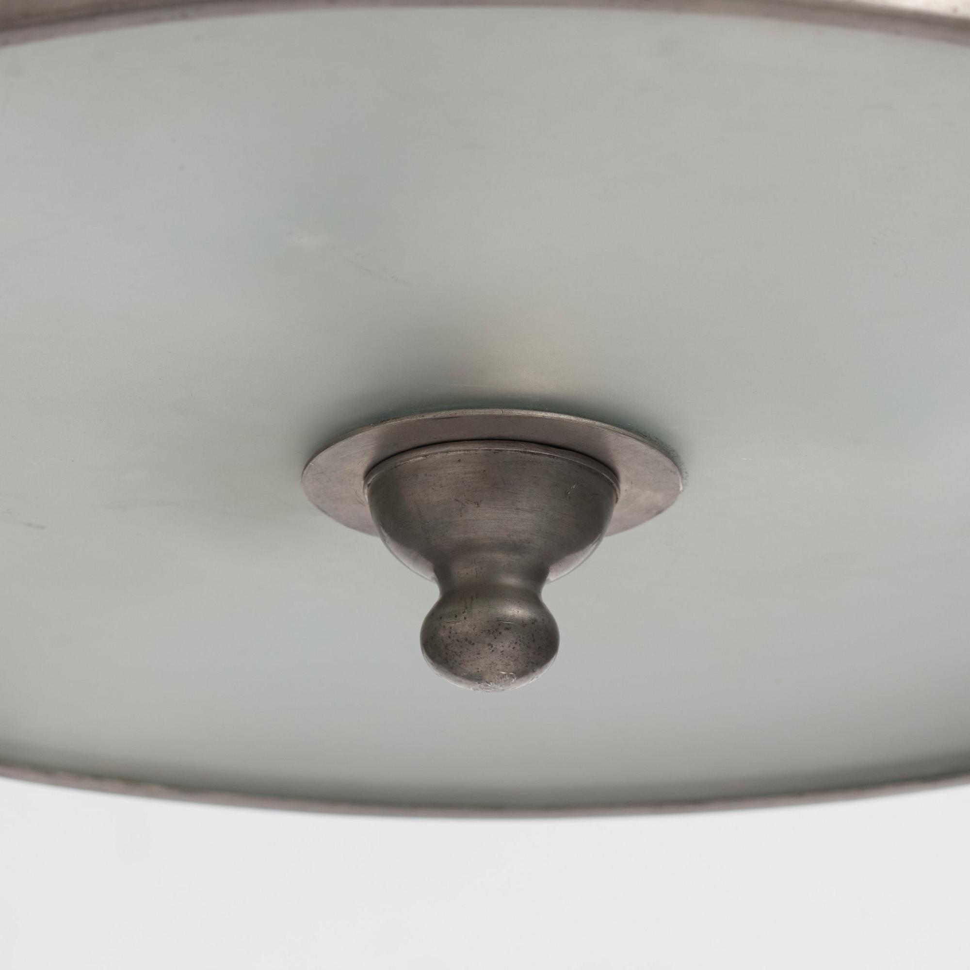 Firma Svenskt Tenn, a pewter and brass chandelier, Stockholm 1926.