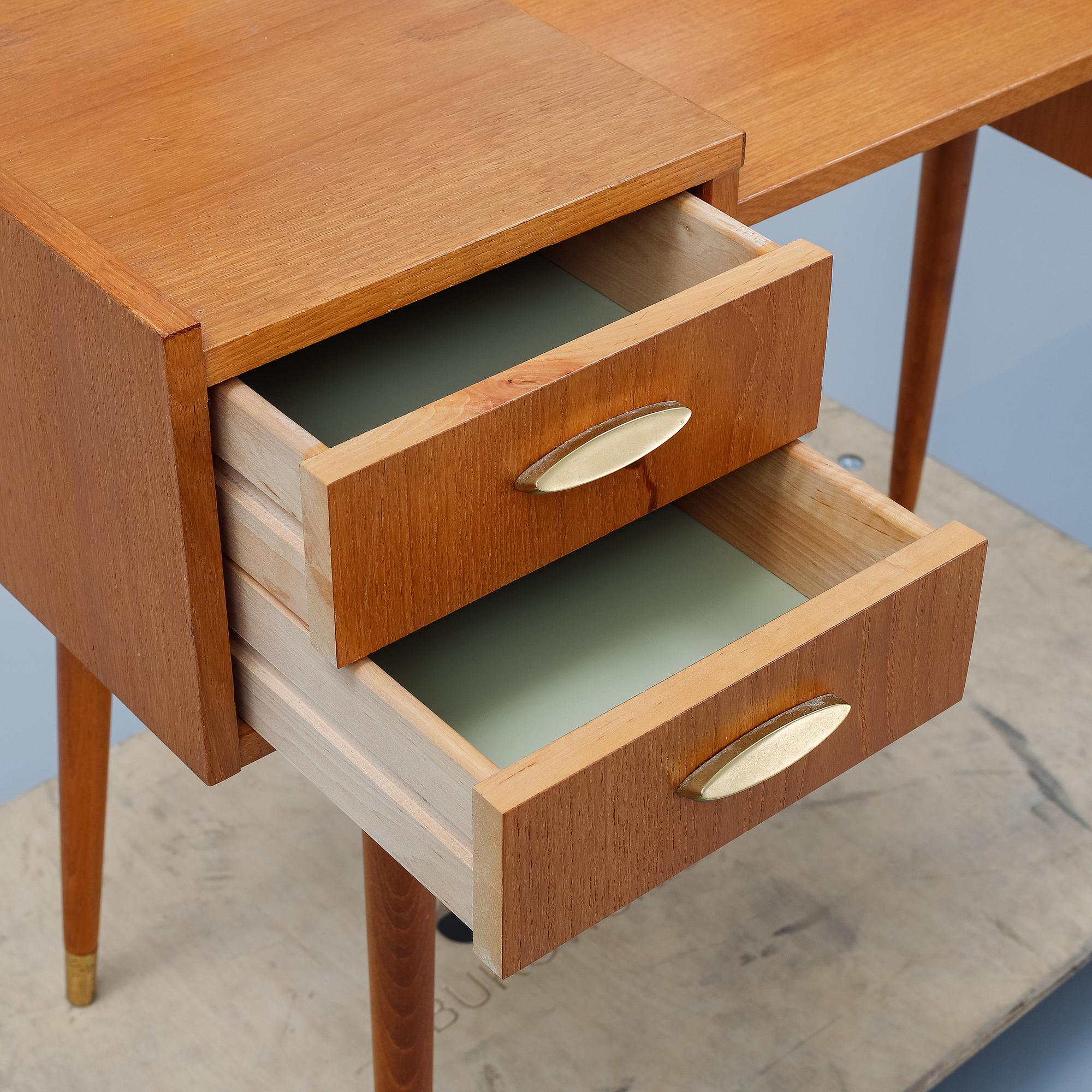 A teak makeup-table from the mid 20th century.