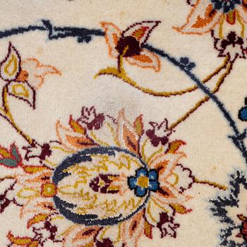 An Isfahan carpet, signed, approx. 372 x 255 cm.