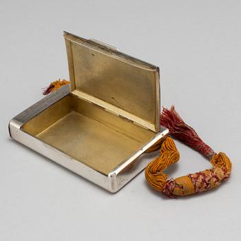 A Russian late 19th century parcel-gilt silver cigarette-case, unidentified makers mark, St. Petersburg.