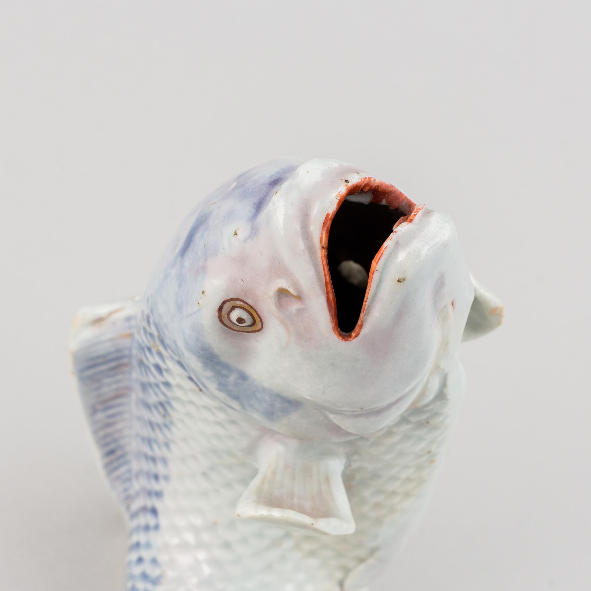 A Japanese porcelain model of a leaping fish, Meiji period (1868-1912).