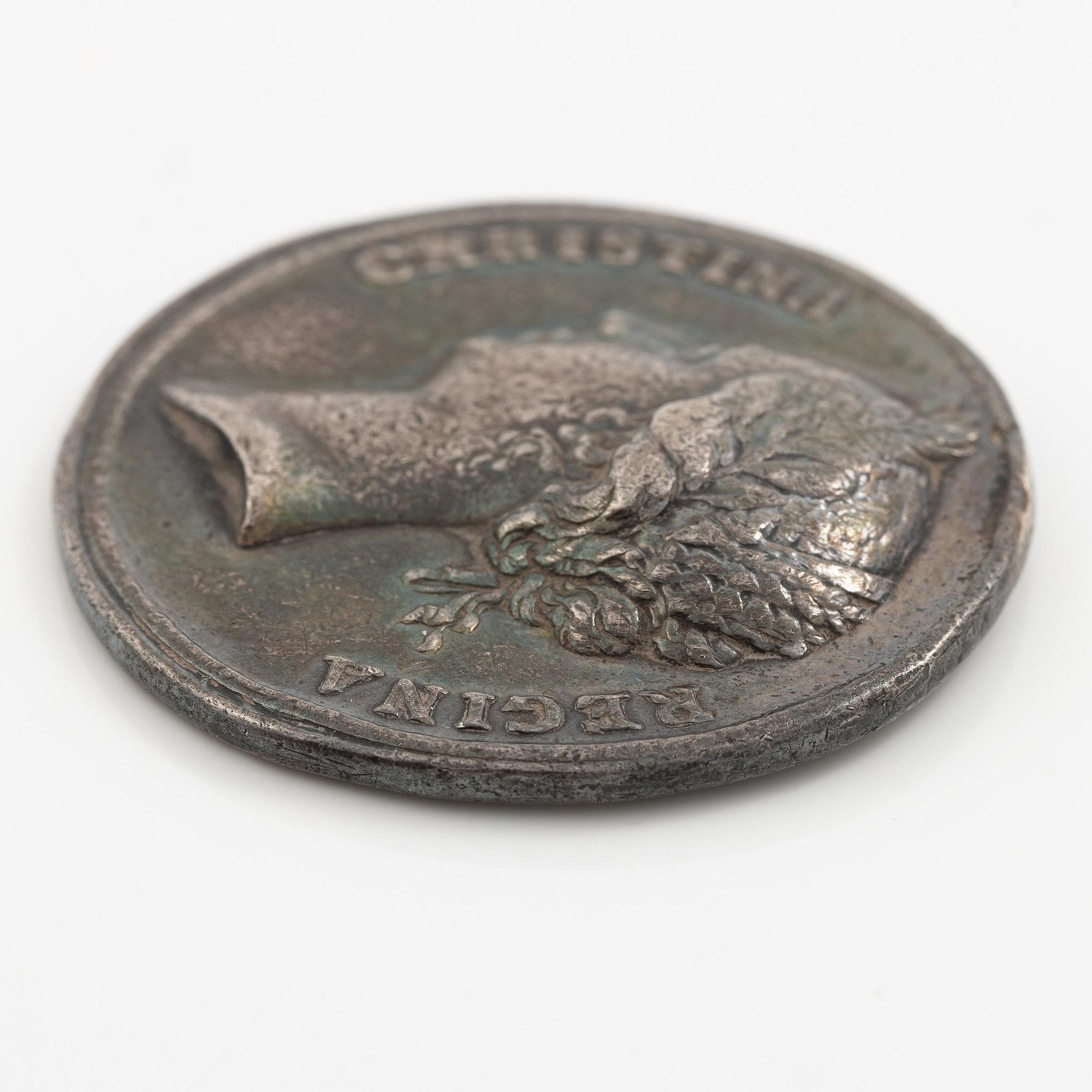 Kastpenning, Drottning Kristinas kröning 1650, av Erich Parise (medaljgravör under 1600-talets mitt).