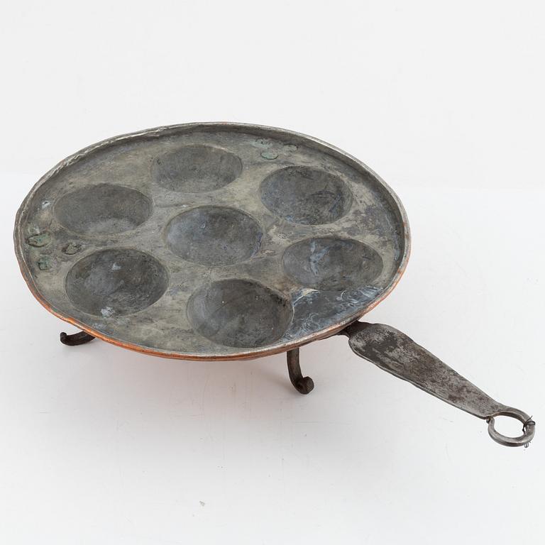 Four cake moulds, and a funnel, copper, 18th and 19th Century.