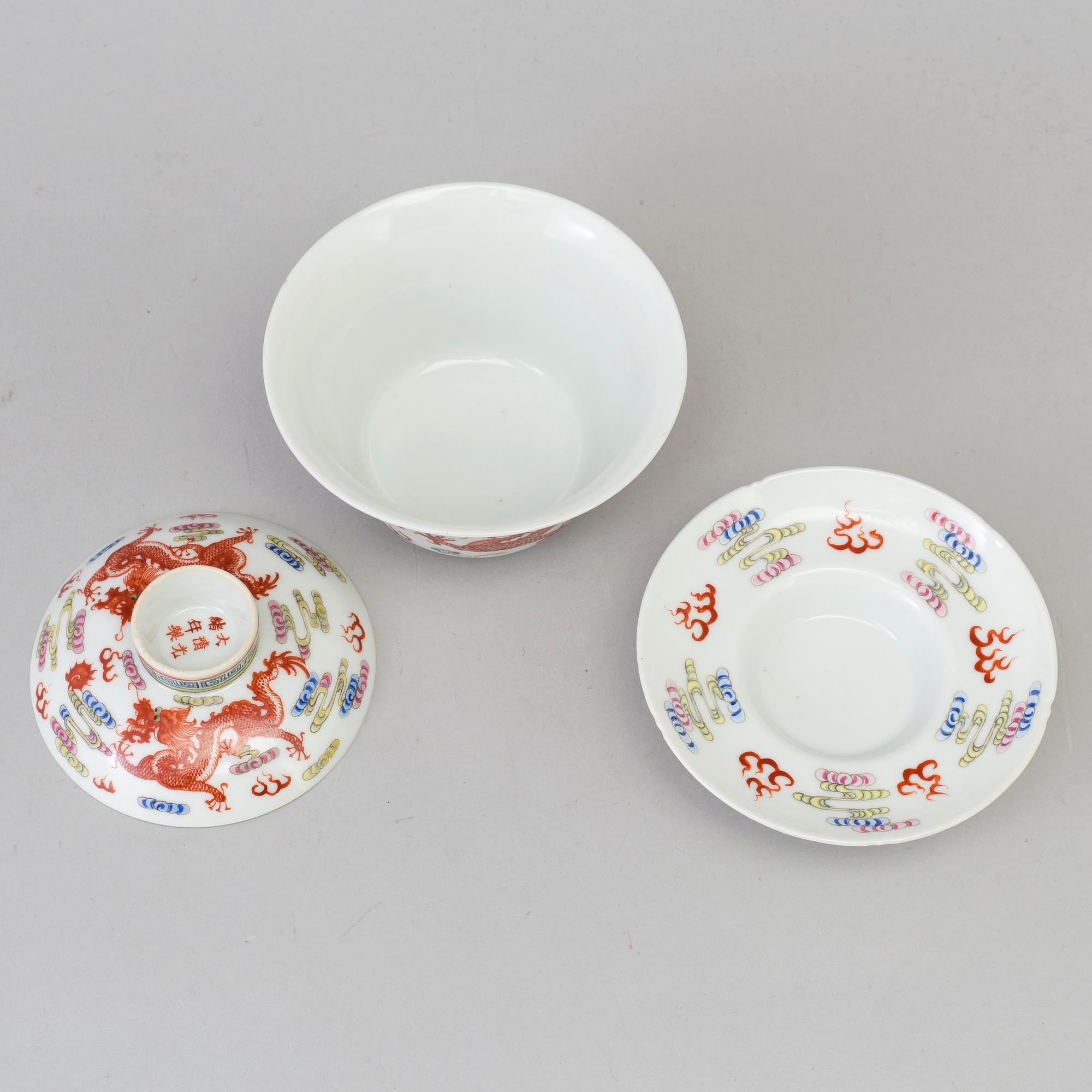 A Chinese 20th century famille rose porcelain cup with cover and dish, with Guangxus six character mark.