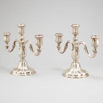 a pair of silver candelabras by K Andersson Gothenburg 1938.