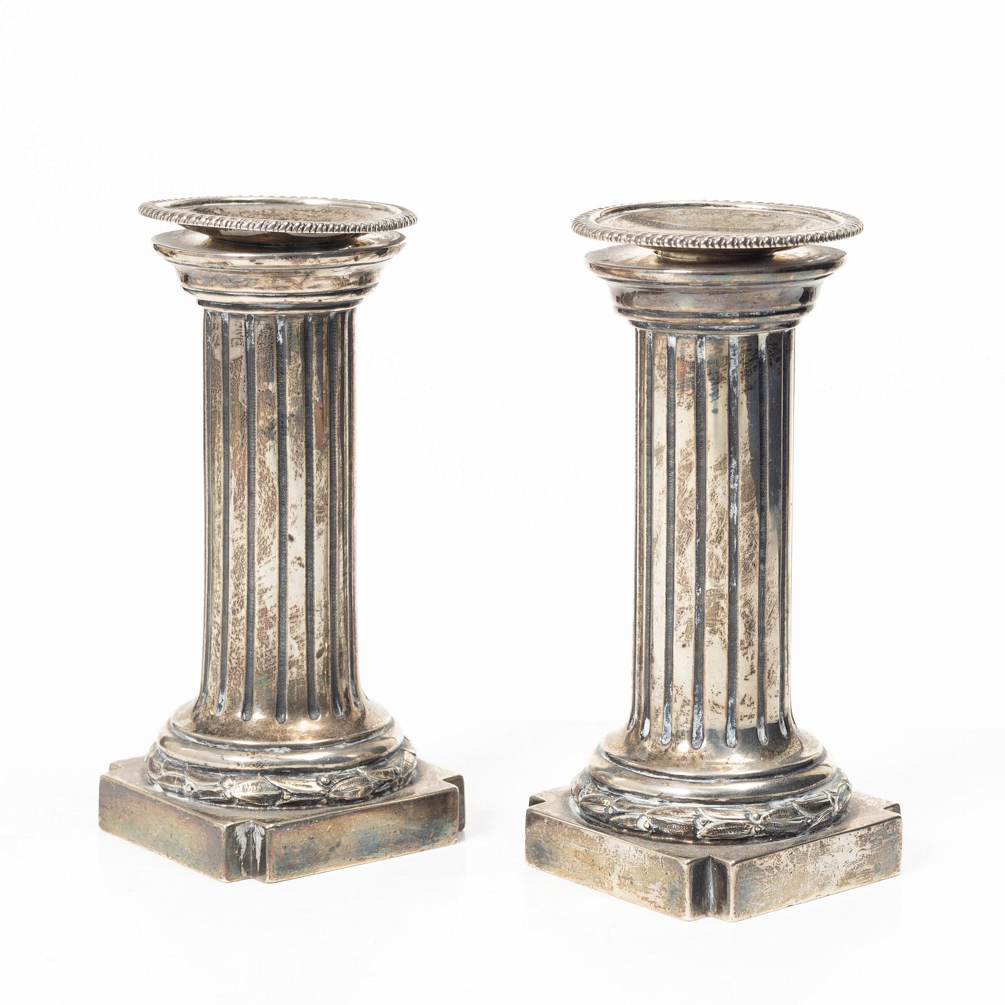 A pair of English silver candlesticks, mark of Arthur Sibley, London 1872.