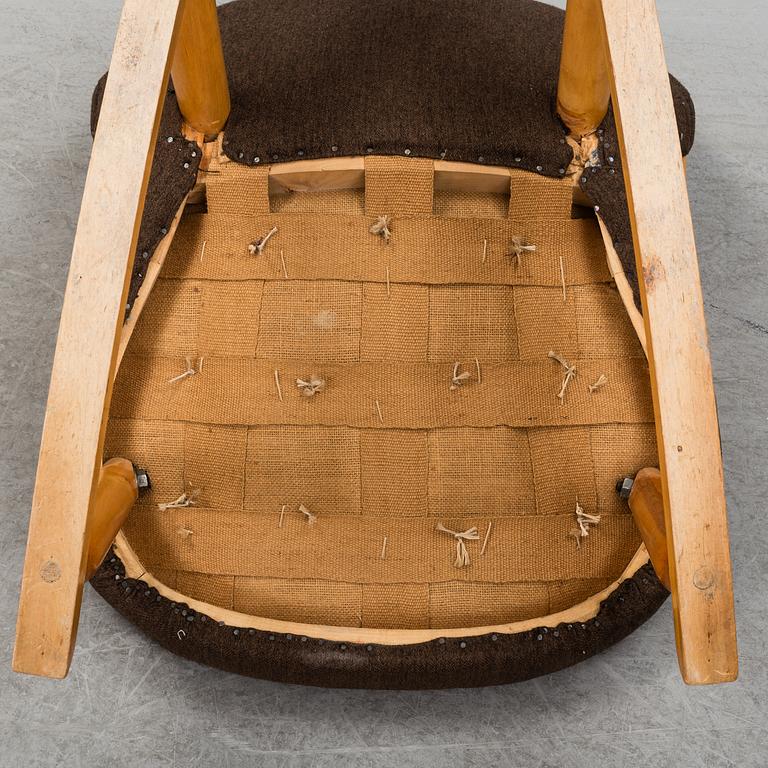A mid 20th century rocking chair, Muslingestolen, attributed to Philip Arctander.