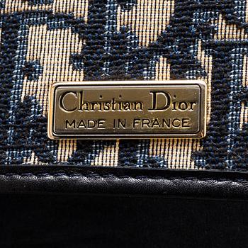 CHRISTIAN DIOR, a set of a clutch, a belt and an umbrella.