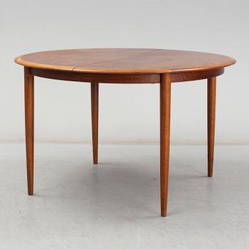 KURT ØSTERVIG, a teak dining suite with a round table and six chairs, Brande Möbelindustri, Denmark.