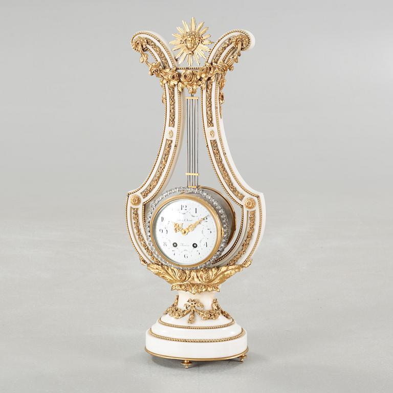 A table clock, dial marked "Gilles l'Ainé Paris", made around year 1900.