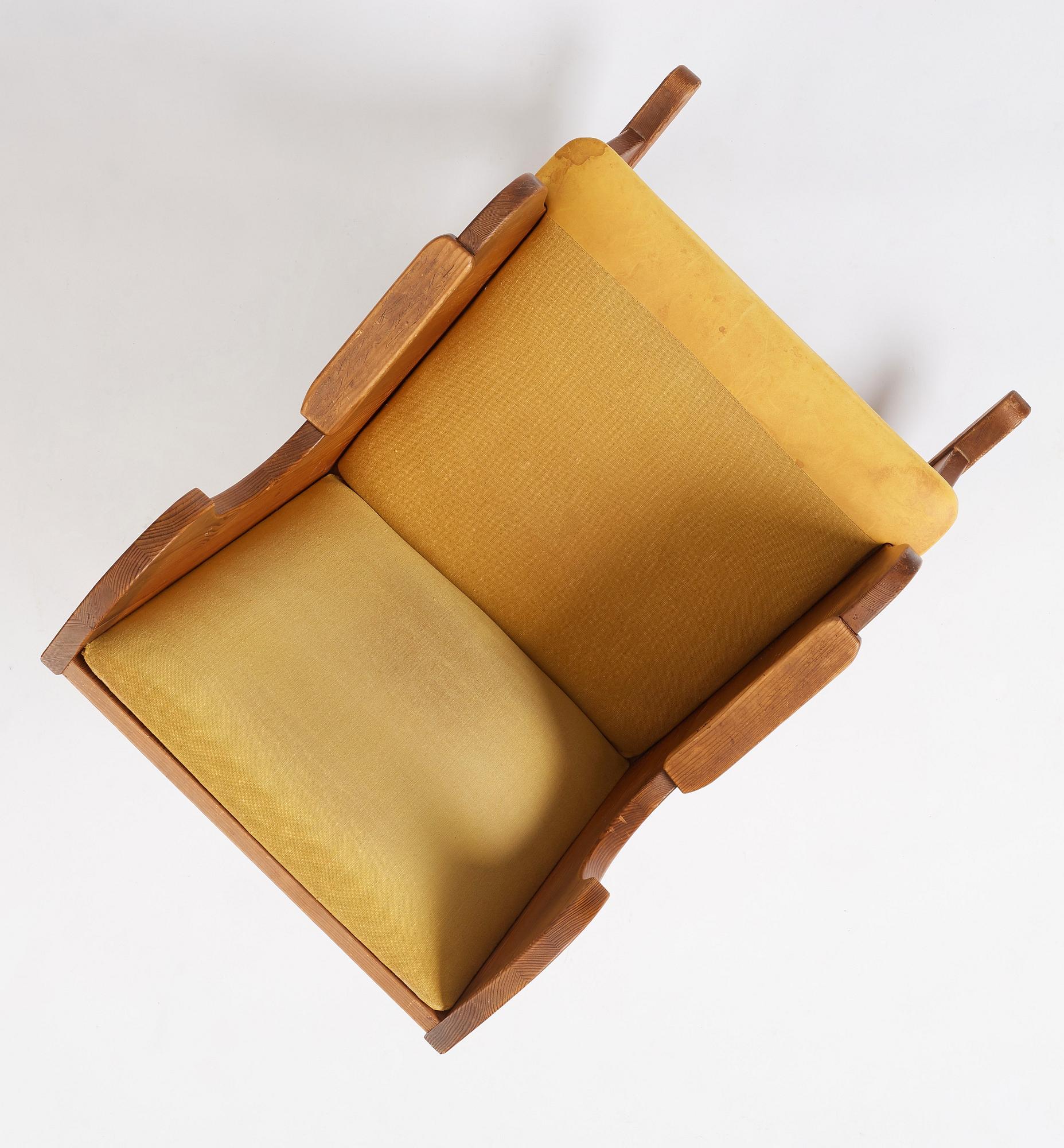Nordiska Kompaniet, a Swedish Modern stained pine 'Lovö' rocking chair.