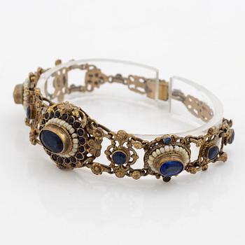 Bracelet, gilded silver with synthetic blue stones.
