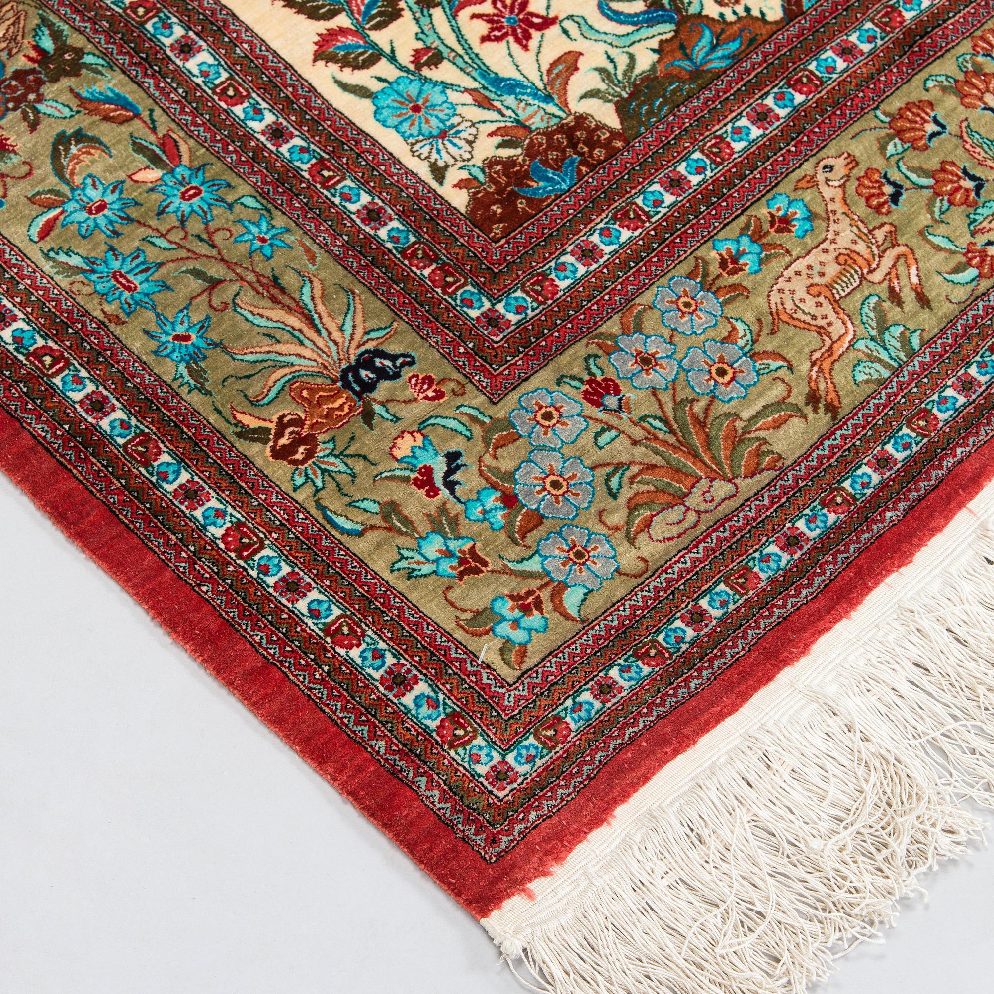 A silk Qum rug, central Persia, c. 210 x 138 cm.