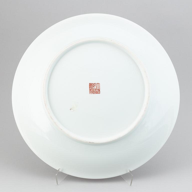 A large Chinese dish with a fierce five clawed dragon, modern.