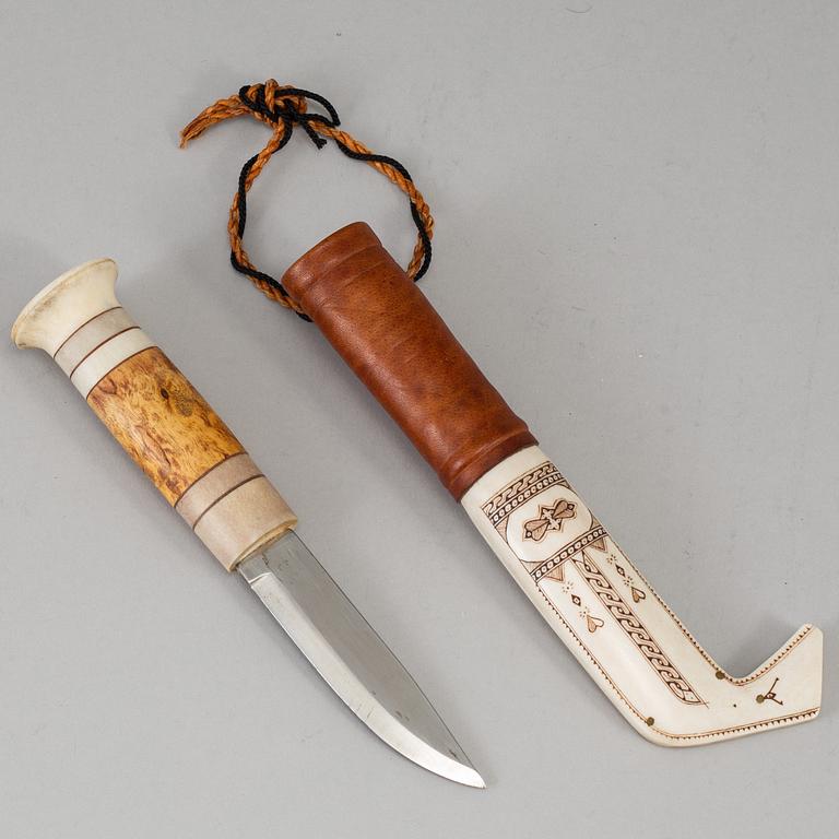 A Sami reindeer horn knife, unidentified signature.