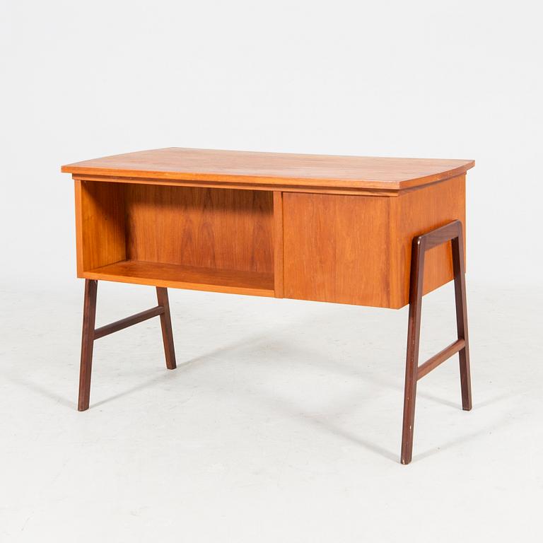 A veneered desk from the mid 1900's.